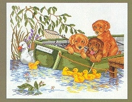 Puppies in Boat / Eva Rosenstand